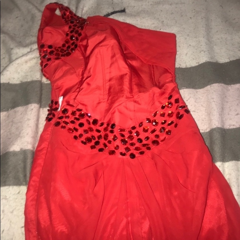 Red one shouldered gown